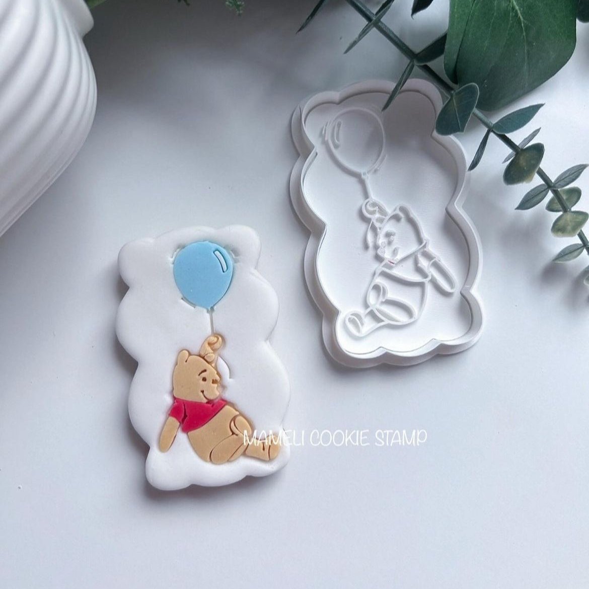 Winnie l'Ourson et son ballon